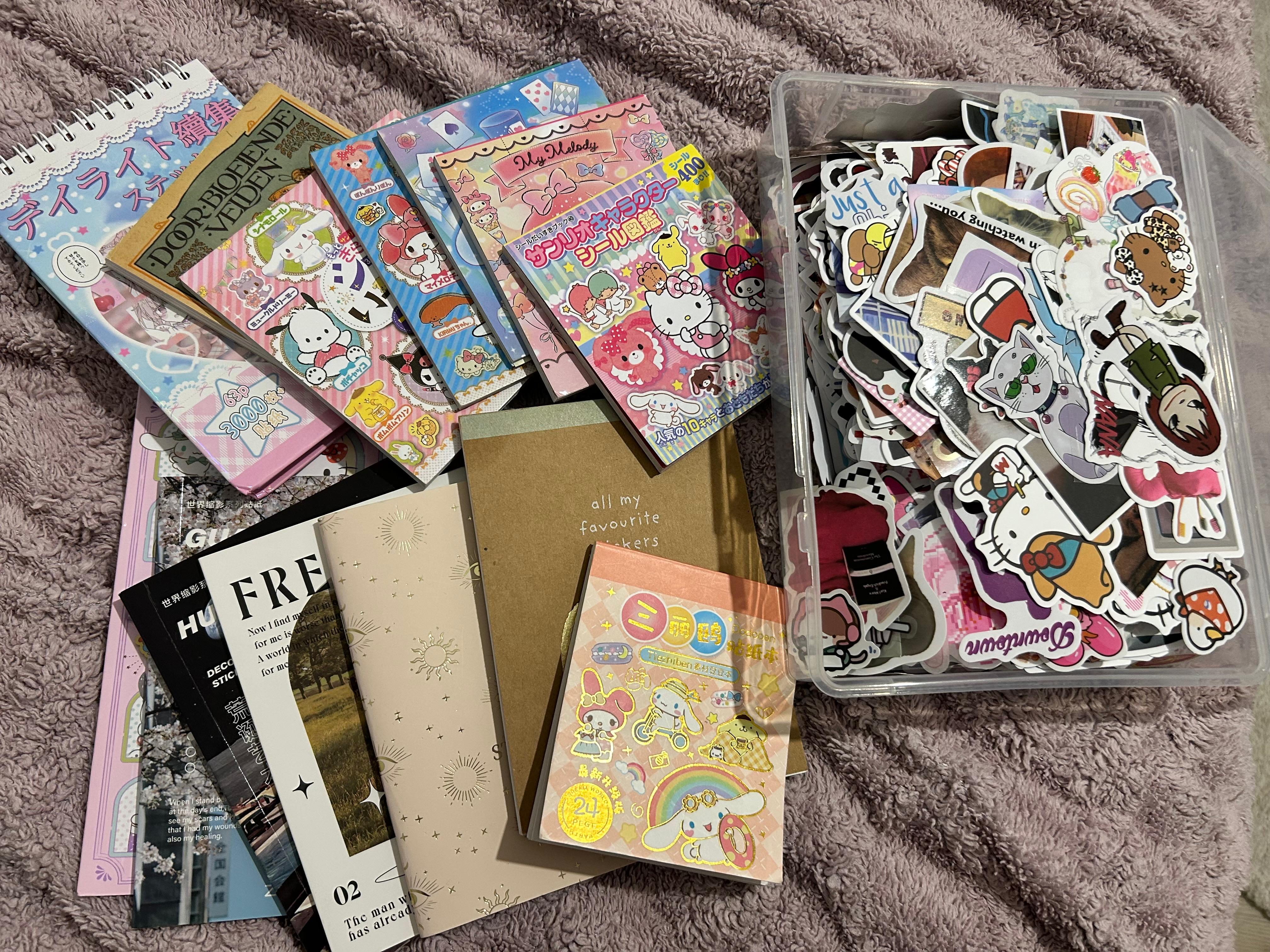 A box full of stickers , with sticker books