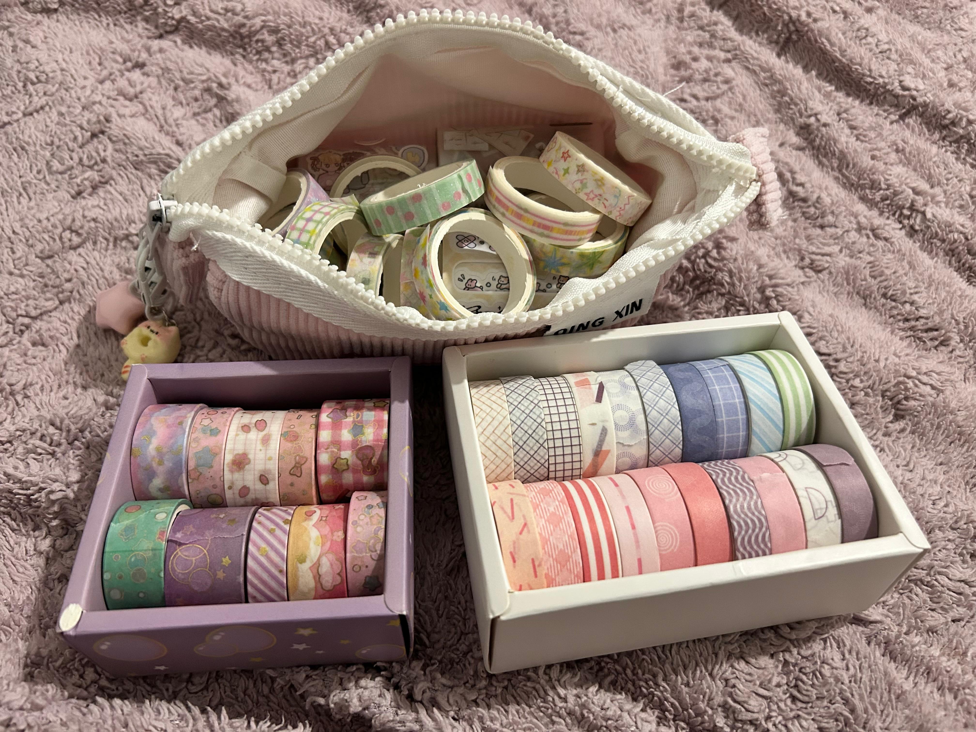 A pencil case full of washi tapes, with more in little boxes.
